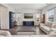 Spacious living room featuring hardwood floors, large windows, and stylish decor at 15023 Longmoore Dr, Charlotte, NC 28278