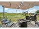 Backyard patio with stylish seating, fire pit and outdoor grill, perfect for entertaining and relaxation at 15023 Longmoore Dr, Charlotte, NC 28278
