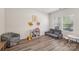 Inviting playroom filled with a variety of toys and furniture and natural light at 15023 Longmoore Dr, Charlotte, NC 28278