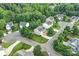 An aerial view shows single-Gathering homes located on well-maintained streets surrounded by mature trees at 1503 Stoney Ct, York, SC 29745