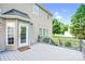Backyard view of the two story house highlighting the back deck and door at 1503 Stoney Ct, York, SC 29745