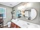 Bathroom with double vanity, round mirrors, gray walls, and unique décor for a stylish space at 1503 Stoney Ct, York, SC 29745