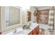 Bathroom showcasing double sinks, mosaic tile shower, and neutral walls for a relaxing space at 1503 Stoney Ct, York, SC 29745