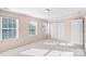 Bright bedroom with neutral walls, three windows, plush carpeting, closet and two doors at 1503 Stoney Ct, York, SC 29745