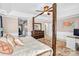 Spacious bedroom boasts a four-poster bed, tray ceiling, and neutral walls, creating a serene retreat at 1503 Stoney Ct, York, SC 29745