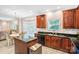 Stylish kitchen featuring granite countertops, stainless steel appliances, and wood cabinets at 1503 Stoney Ct, York, SC 29745