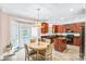 Bright kitchen featuring a dining table, a center island, wood cabinets, and modern appliances at 1503 Stoney Ct, York, SC 29745