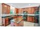 Modern kitchen featuring granite countertops, stainless steel appliances, and wood cabinets at 1503 Stoney Ct, York, SC 29745