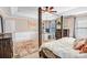 Main bedroom with a workspace, four-post bed, ceiling fan, and views of the yard at 1503 Stoney Ct, York, SC 29745