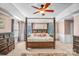 Spacious main bedroom featuring a four-post bed, a ceiling fan, and natural light at 1503 Stoney Ct, York, SC 29745