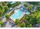An aerial view showcases a community pool with lounge chairs, a playground, parking, and well-maintained landscaping at 1503 Stoney Ct, York, SC 29745
