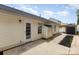Backyard area featuring a white house with white siding, a shed, and a paved walkway to the back door at 1776 Baylor Dr, Rock Hill, SC 29732