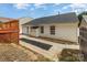 Backyard featuring a house with white siding, a shed, a deck, and a walkway at 1776 Baylor Dr, Rock Hill, SC 29732
