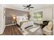 A bedroom boasts modern decor, a ceiling fan, and ample natural light at 1776 Baylor Dr, Rock Hill, SC 29732