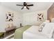 Bright primary bedroom features two closets, modern decor, and a ceiling fan at 1776 Baylor Dr, Rock Hill, SC 29732