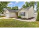 Angle-shot of a single-Gathering home with well-maintained lawn, walkway, and two-car garage on a sunny day at 1776 Baylor Dr, Rock Hill, SC 29732
