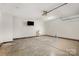 Spacious garage with high ceilings, a mounted television, and a utility sink for cleanup at 1776 Baylor Dr, Rock Hill, SC 29732