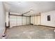 Spacious garage featuring white walls, concrete floors, and a large garage door for easy vehicle access at 1776 Baylor Dr, Rock Hill, SC 29732