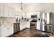 Modern kitchen featuring white cabinets, stainless steel appliances, and sleek countertops for the home chef at 1776 Baylor Dr, Rock Hill, SC 29732