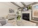Cozy living room with a fireplace, hardwood floors, and contemporary decor is perfect for entertaining guests at 1776 Baylor Dr, Rock Hill, SC 29732