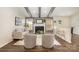 Inviting living room with fireplace, exposed beams, and hardwood floors provides a cozy gathering space at 1776 Baylor Dr, Rock Hill, SC 29732