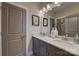 Stylish bathroom featuring a double vanity with granite countertops and modern lighting at 18145 Sulton Ter, Huntersville, NC 28078