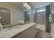 Elegant bathroom featuring double sinks, granite counters, tub and shower combo at 18145 Sulton Ter, Huntersville, NC 28078