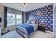 Charming bedroom with playful wallpaper and a comfortable bed at 18145 Sulton Ter, Huntersville, NC 28078