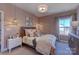 Comfortable bedroom with pink walls, nightstands, and a window at 18145 Sulton Ter, Huntersville, NC 28078