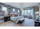 Serene main bedroom with a bay window, stylish wallpaper, king-size bed, and ample natural light at 18145 Sulton Ter, Huntersville, NC 28078