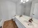 Spacious bathroom featuring double sinks and a large mirror at 18414 Victoria Bay Dr, Cornelius, NC 28031