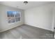 Cozy bedroom features a large window offering natural light at 18414 Victoria Bay Dr, Cornelius, NC 28031
