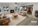 Bright living room with fireplace, plush seating, and an open layout with easy access to the kitchen at 18414 Victoria Bay Dr, Cornelius, NC 28031