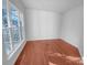 Bright room with hardwood floors and natural light streaming through the large window at 18414 Victoria Bay Dr, Cornelius, NC 28031