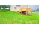 Backyard with a wooden deck leading from the house, and a grassy yard at 1872 Terrain Nw Dr, Conover, NC 28613