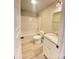 Well-lit bathroom featuring a granite countertop vanity, tub with shower, and updated fixtures at 1872 Terrain Nw Dr, Conover, NC 28613