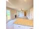 Open-concept living room features a fireplace, ceiling fan, and lots of natural light at 1872 Terrain Nw Dr, Conover, NC 28613