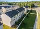 Aerial view showcases a community of townhomes, well-maintained landscaping, and convenient street access at 2037 Langer St, Charlotte, NC 28214