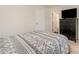 Comfortable bedroom with neutral walls, a TV on the dresser, and carpeted floors at 2037 Langer St, Charlotte, NC 28214