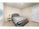Cozy bedroom with a queen-size bed, carpet, and neutral decor at 2037 Langer St, Charlotte, NC 28214