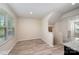 Inviting dining area with plenty of natural light, showcasing a neutral color palette and wood-style flooring at 2037 Langer St, Charlotte, NC 28214