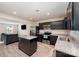 Well-lit kitchen featuring an island, stainless appliances, and granite countertops, perfect for cooking at 2037 Langer St, Charlotte, NC 28214