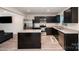 Modern kitchen featuring stainless steel appliances, a granite island, and dark cabinetry at 2037 Langer St, Charlotte, NC 28214