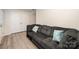 Cozy living room featuring a comfortable sofa, wood-look flooring, and a door to the exterior at 2037 Langer St, Charlotte, NC 28214