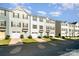 Charming townhomes with garages, colorful doors, and manicured lawns offer appealing curb appeal at 2037 Langer St, Charlotte, NC 28214