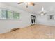 Inviting basement with tile floors, white walls, bright windows, and ample room for entertaining at 2255 Milton Rd, Charlotte, NC 28215
