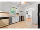 Kitchen with classic cabinetry, tile floors, and an eat-in dining area at 2255 Milton Rd, Charlotte, NC 28215