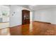 Spacious living room with wood floors, neutral paint, and built in storage, bright and airy at 2255 Milton Rd, Charlotte, NC 28215