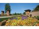 Stone and brick entrance to a landscaped community with beautiful colorful seasonal floral arrangements at 2336 Salute Blvd, Mint Hill, NC 28227
