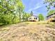 New home featuring a spacious backyard and deck, perfect for outdoor enjoyment and entertaining, with potential for landscaping at 253 Hall Nw Ave, Concord, NC 28027